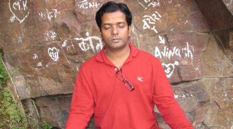 This is a photo of Vinayak Kaurwar meditating. Vinayak Kaurwar is the author of the recent book, "Subway Mantras"